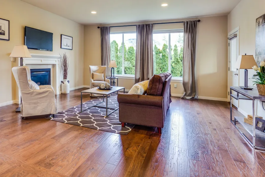 Hand-scraped hardwood floor in a warm, lamp-lit living room